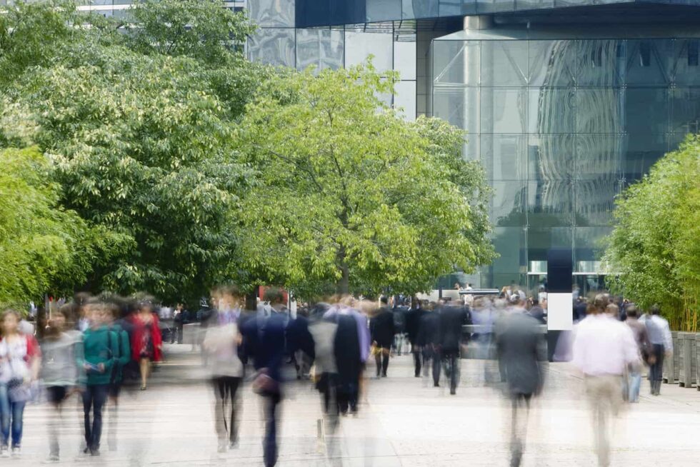 people walking on street in central business district of city