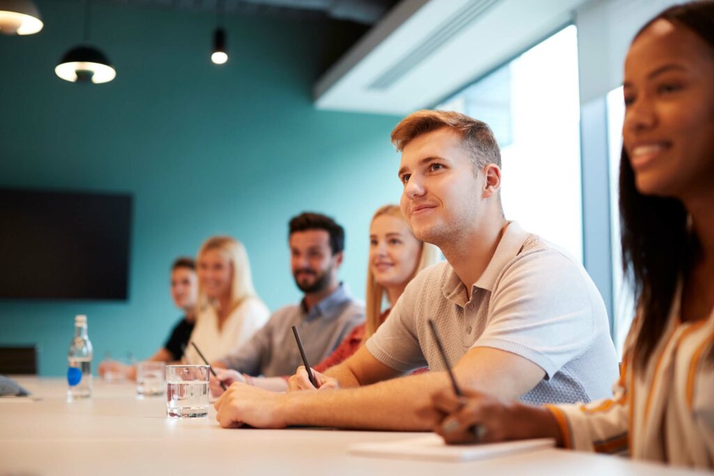 employees around meeting table
