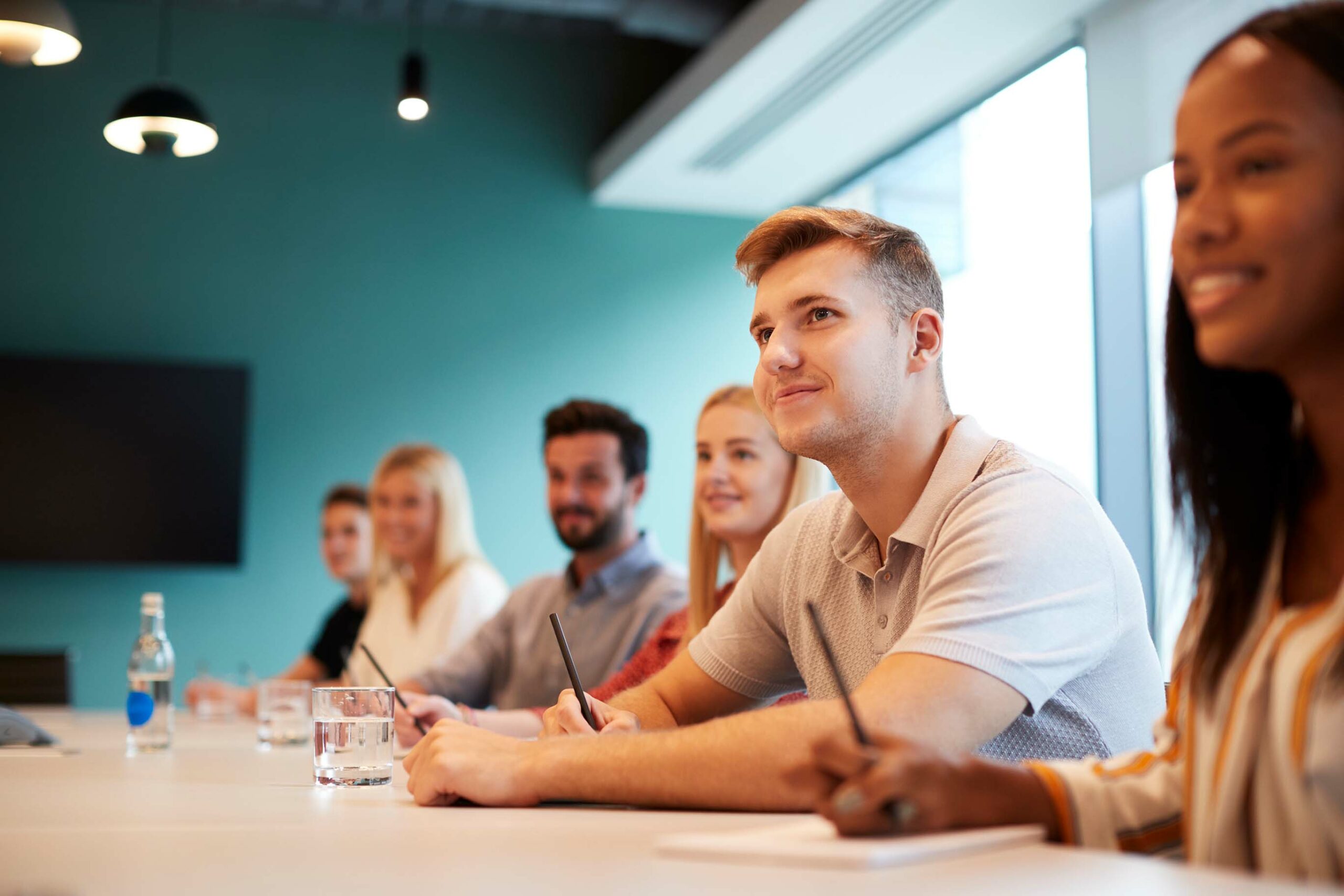 employees around meeting table
