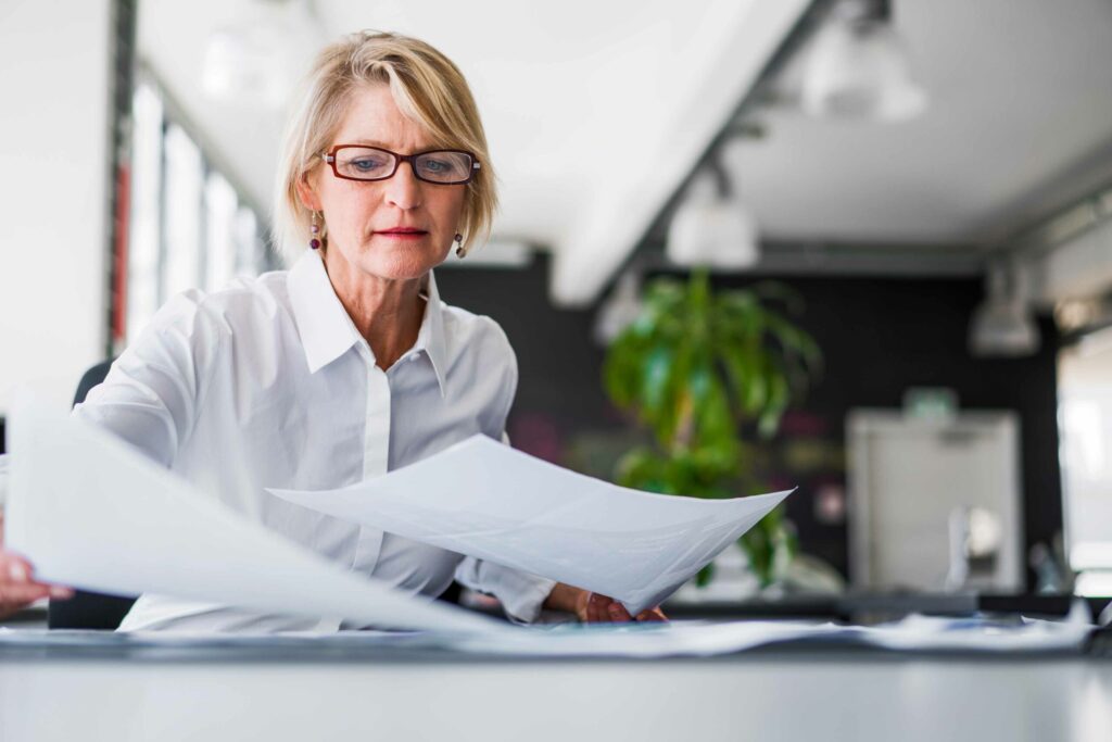 woman looking at documents in office