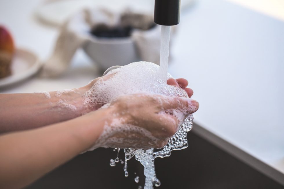 washing hands under tap