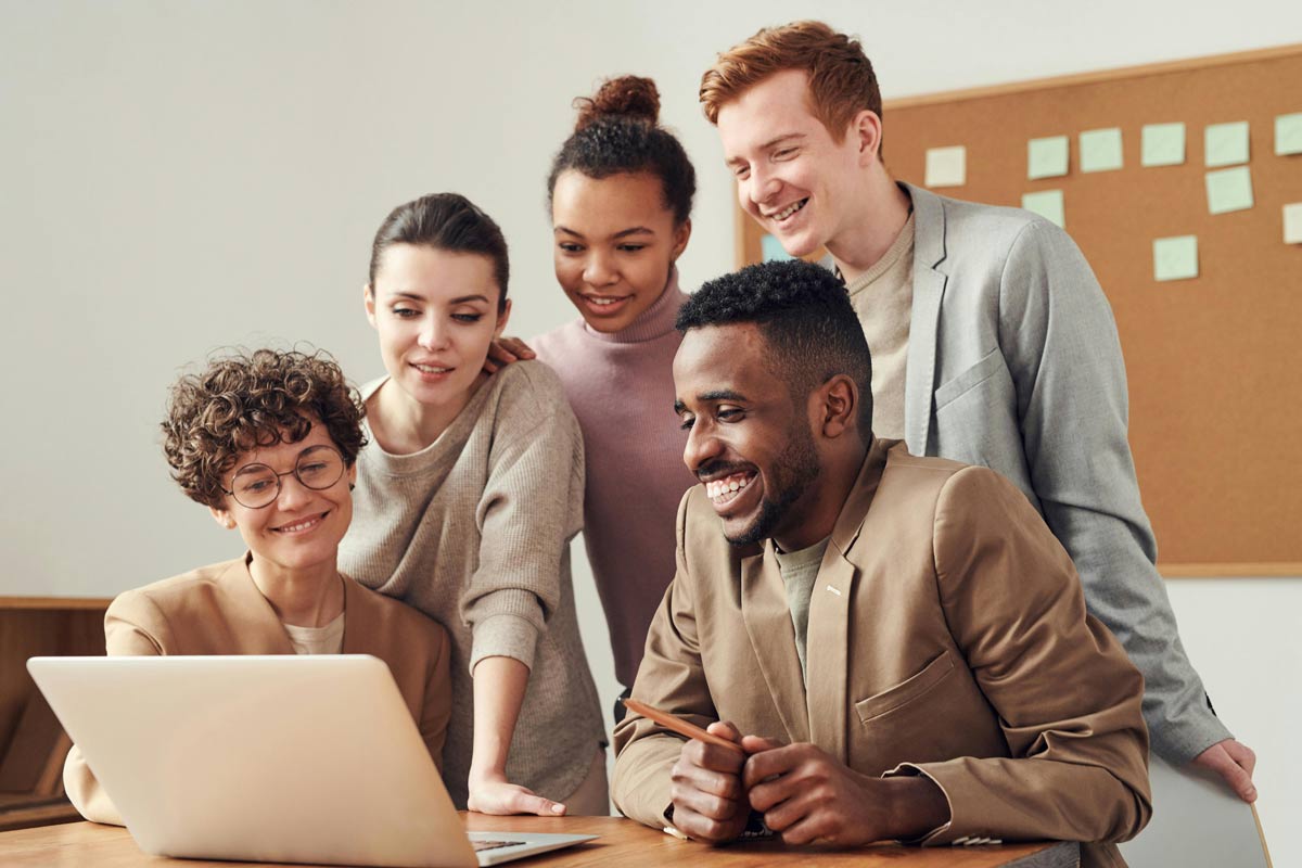 team collaboration around a laptop