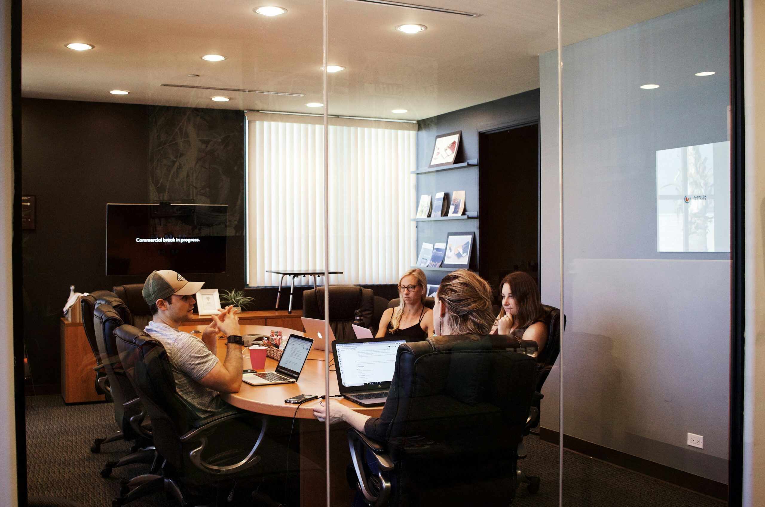 people around a table in an office meeting room